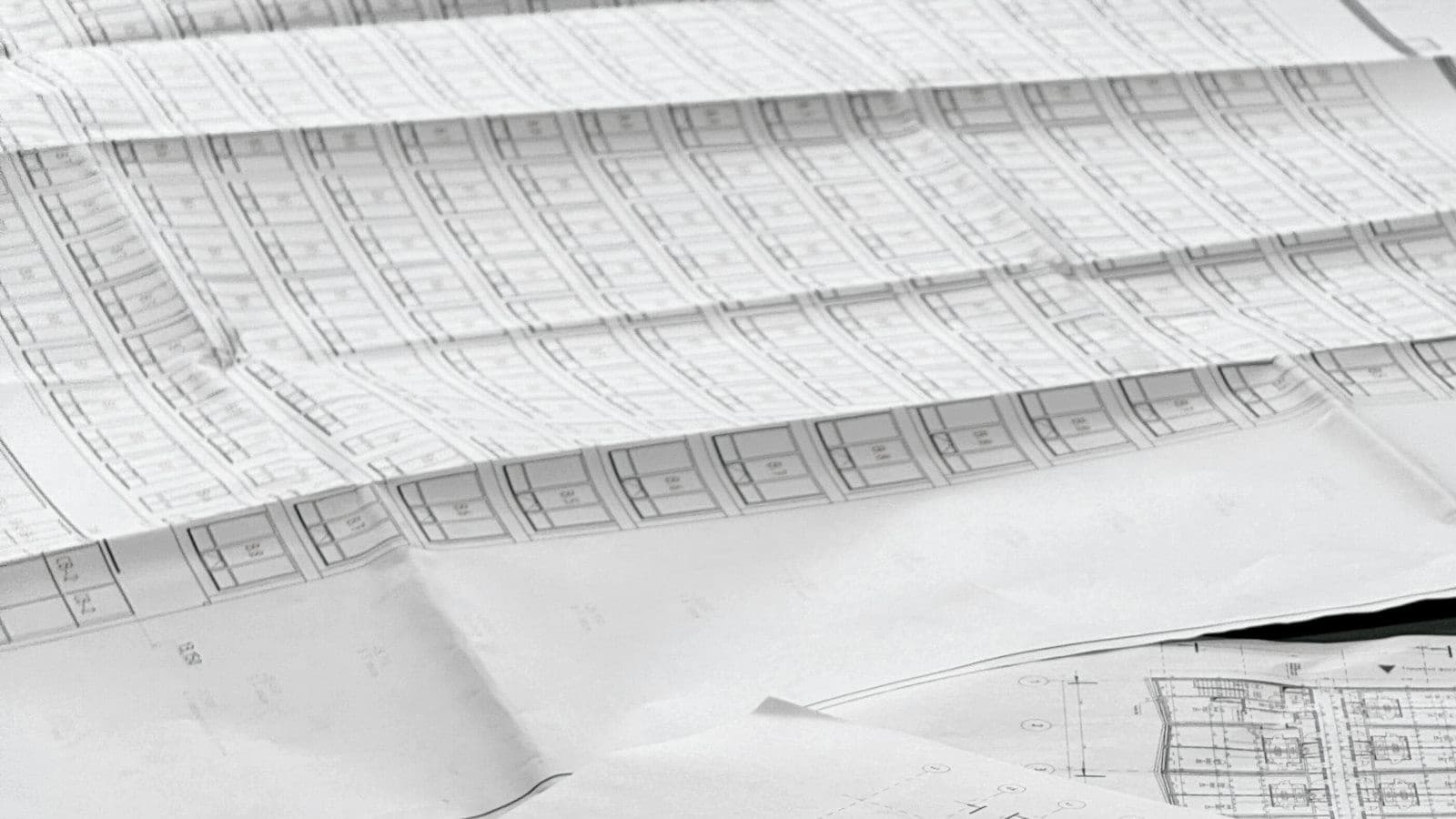Architectural drawings spread across a table