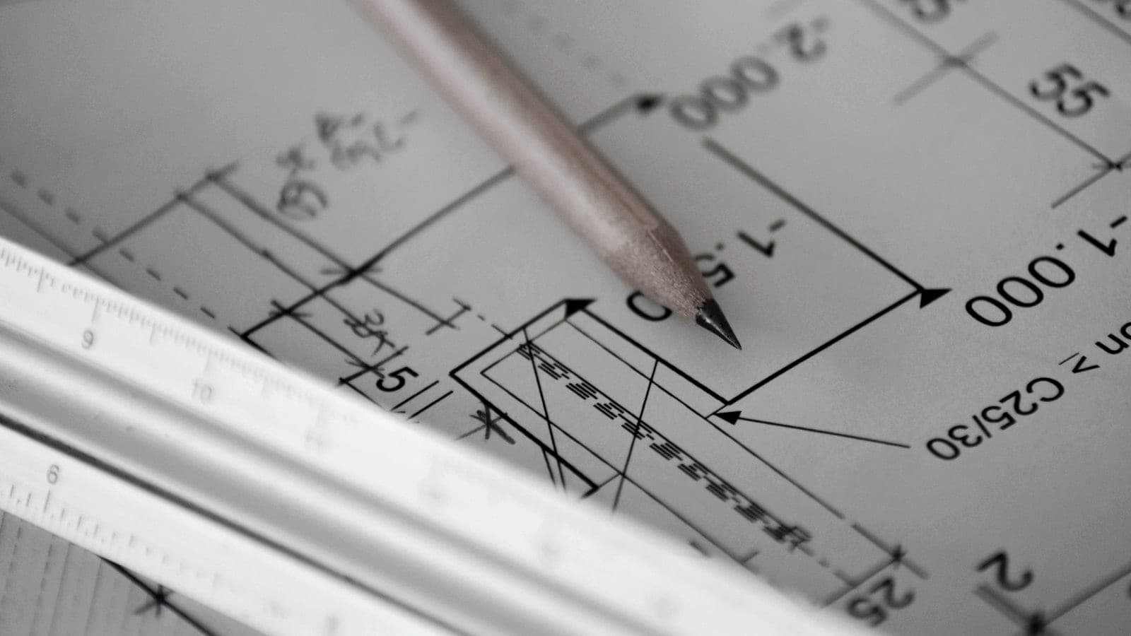 Pencil resting on a technical drawing