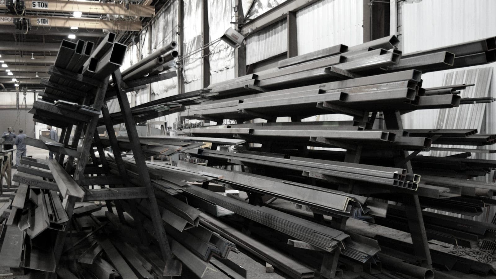 Stack of steel beams in a yard
