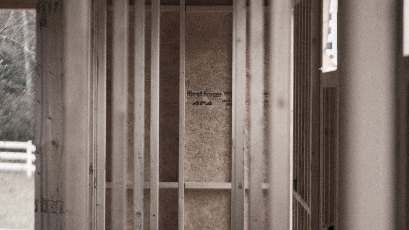 Room under construction with exposed timber framing